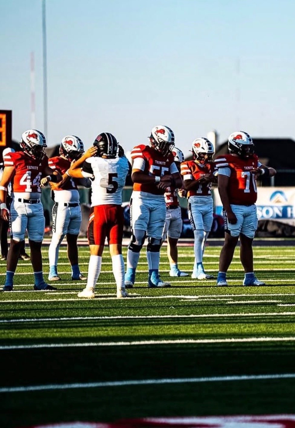 Trinity Lions huddle before the snap