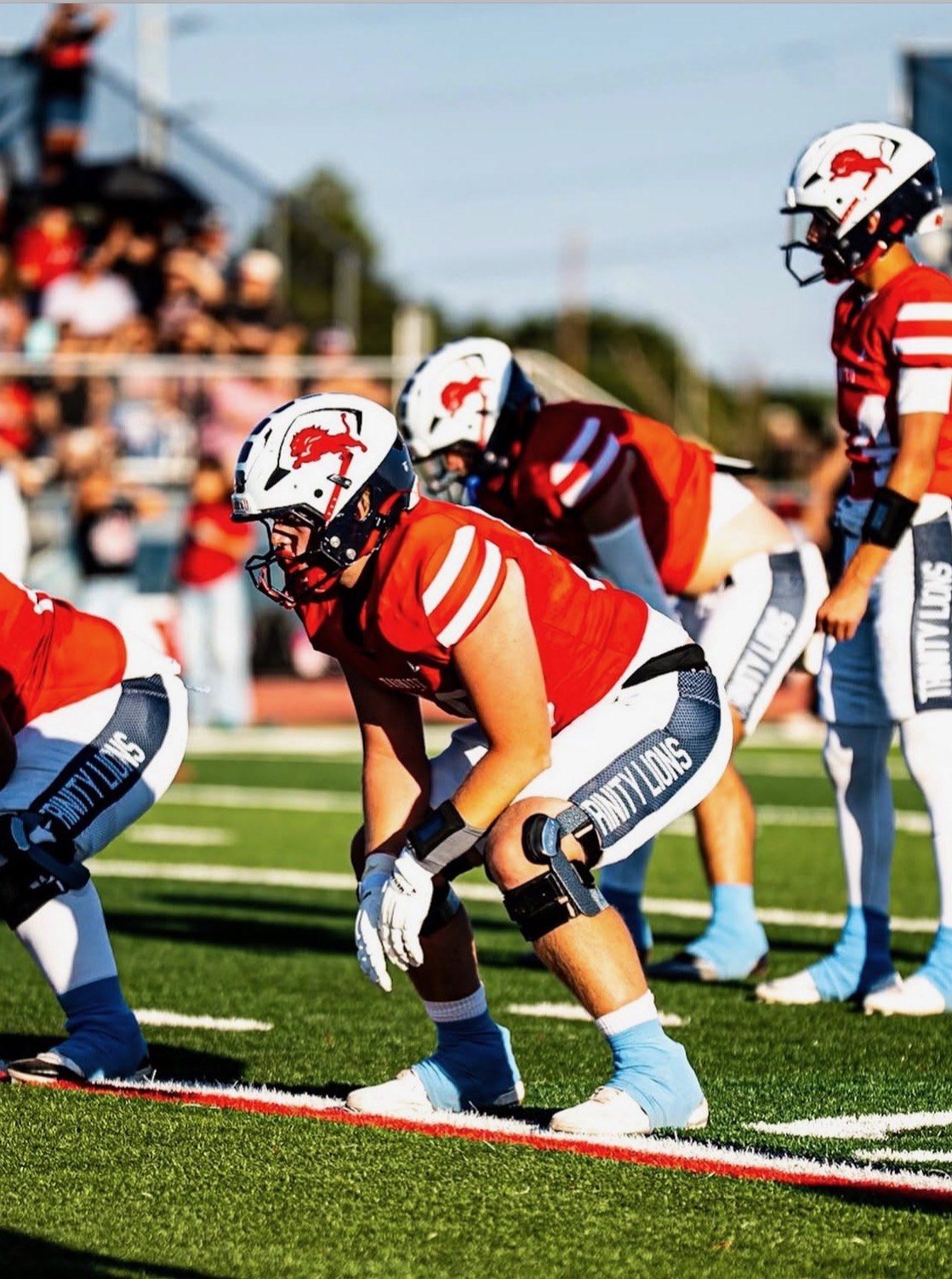 Trinity Lions lineman set at the line of scrimmage