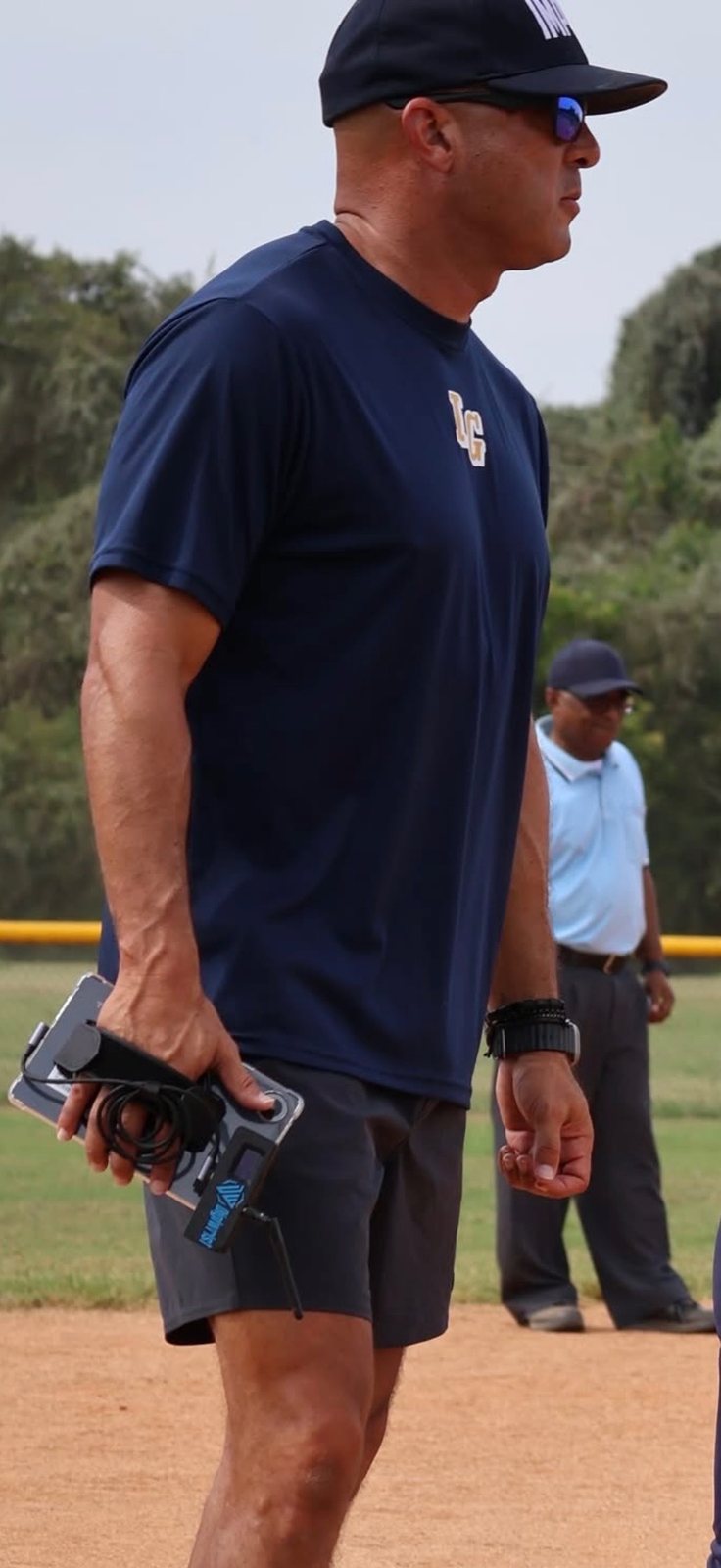 Coach calling pitches from the DigiWrist handheld